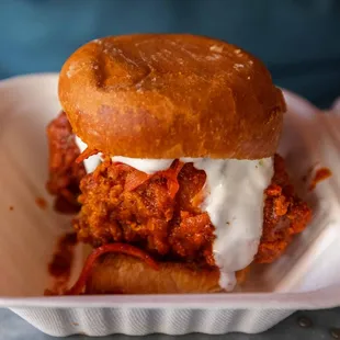 a chicken sandwich in a styrofoam container