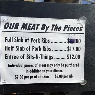 a meat by the pieces sign