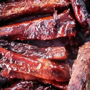 a close up of ribs and meat
