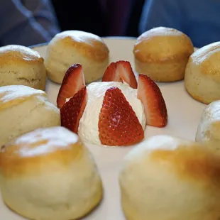 a plate of biscuits and strawberries