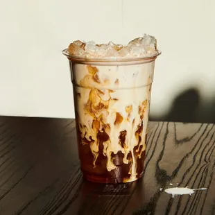 a cold drink in a plastic cup