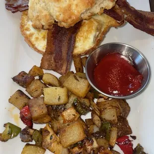 Bacon egg and cheese biscuit with home fries.