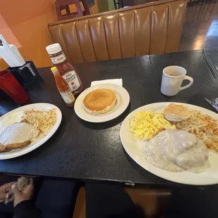 Chicken fried steak and sunny side up eggs on the left, chicken fried chicken and scrambled eggs on the right!