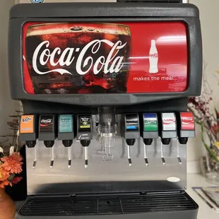 a coca cola machine on a counter