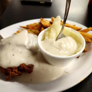 Chicken fried chicken, fies, mashed potatoes