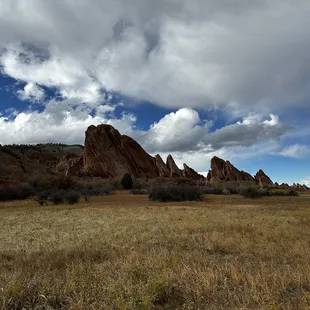 Hiking along the trail with beautiful cloud formations above