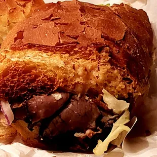 Slices of roast beef "flowing" out of the end