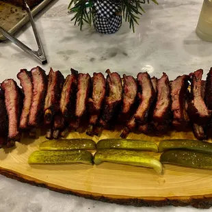  a platter of ribs and pickles