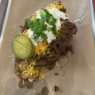 Our famous Buzzard Egg! Potato loaded with beef or pork and all the fixins!