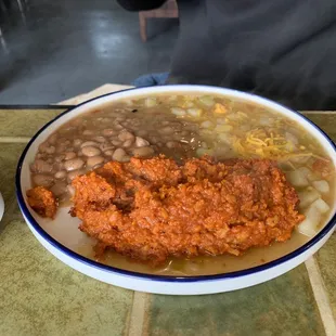 Chilaquiles with beans and green chili potatoes  - yum