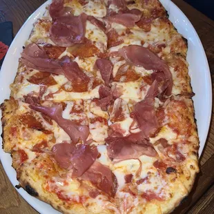 Three-Meat flatbread pizza