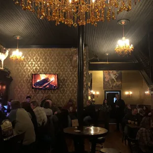 Beautiful amber resin chandeliers provide warm, welcoming ambience overhead.