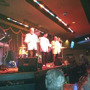 a band performing on stage