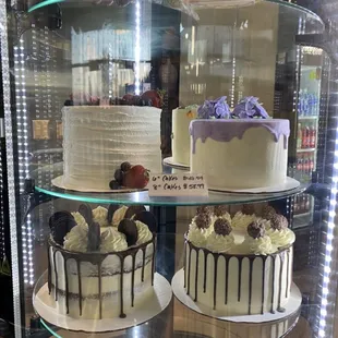three cakes on display