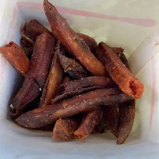 a close up of a basket of fries
