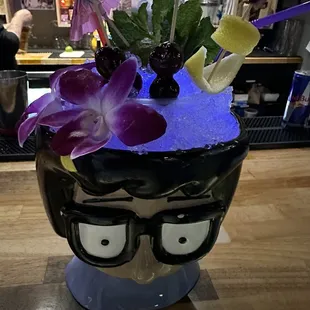 a cup with flowers in it