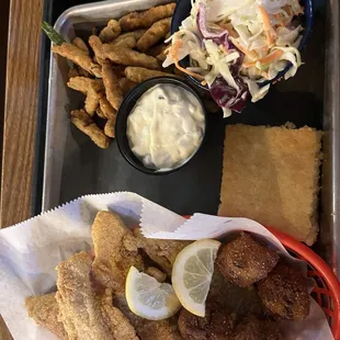 Catfish with hush puppies, fries and coleslaw.