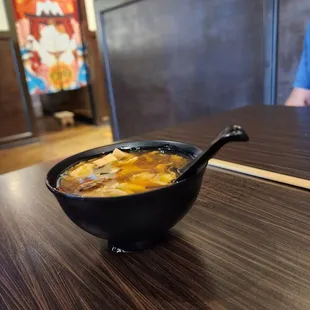 Hot &amp; sour cup of soup,  small serving good for a taste, spicy with crisp vegetables, tofu and mushrooms.
