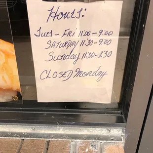 a sign in the window of a restaurant