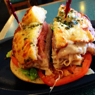 Hot italian club w/ bacon on toasted herbs and cheese