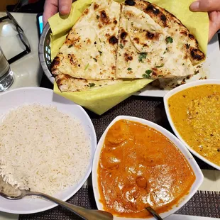 Garlic naan, butter chicken, and paneer butter masala