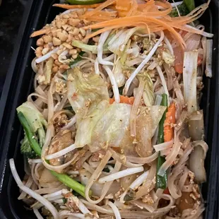 a tray of pad thai food