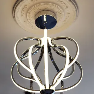 a chandelier with a circular light fixture