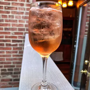 a glass of wine on a table