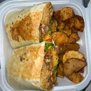 Bourbon chicken burrito with rice, cheese, lettuce, tomato and a side of Cajun potato&apos;s.