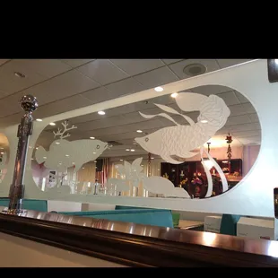 a reflection of a fish in a mirror