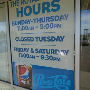 Hours of operation, front window.