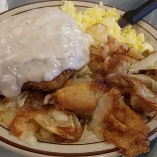 Country fried steak, eggs, and home fries