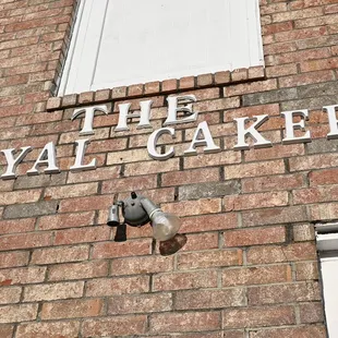 a camera mounted on a brick building