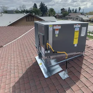 New package Rheem unit on a curb