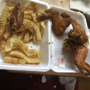 Chicken wings fried hard and fries