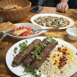Beef Kebab with rice, fresh tomato salad, bread, and eggplant. Delicious all around!