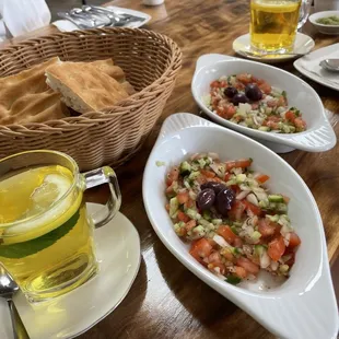 Delicious complimentary tea, fresh bread, and side salads that come with the kabob plates.