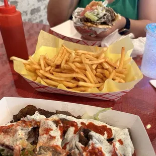 Gyros sandwich and gyros salad bowl with yummy and fresh fries