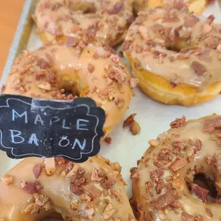 Freshly made maple bacon bits doughnuts.