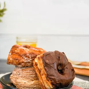 chocolate frosted donuts on a plate