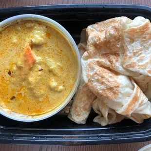 (Take-out) Roti canai. Delicious! Thick gravy with chicken.