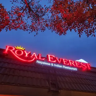 the neon sign for the restaurant