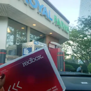 a person holding a red box