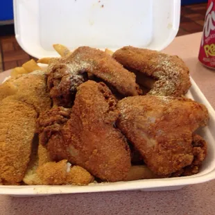Fried Tilapia and Wing Combo with fries.