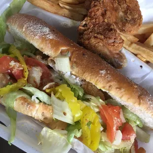 Perch sandwich dinner comes with wings and fries..