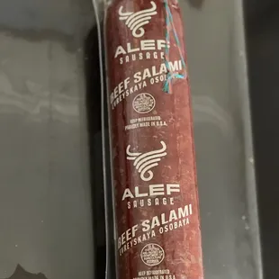 a sausage wrapped in plastic