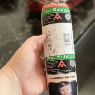 a hand holding a package of food