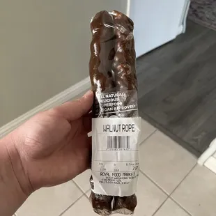 a hand holding a chocolate bear