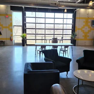 a view of a room with chairs and tables