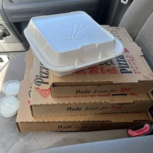 Boxed Pizza. One hawain, one pepperoni, cheesy bread and wings.
